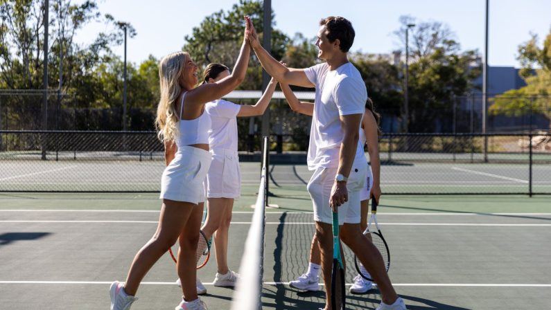 Doubles partners meeting at the net