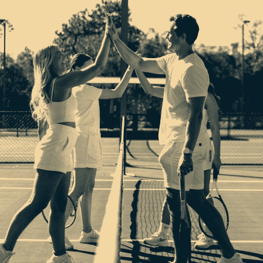 Doubles partners at the net
